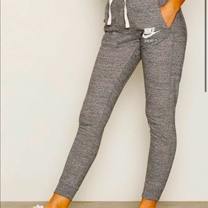 Women’s Nike Tight Joggers. Color Grey, Size Medium